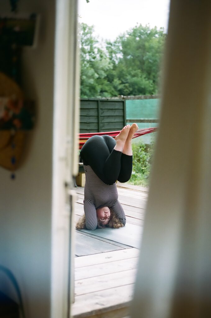 woman practicing yoga outside