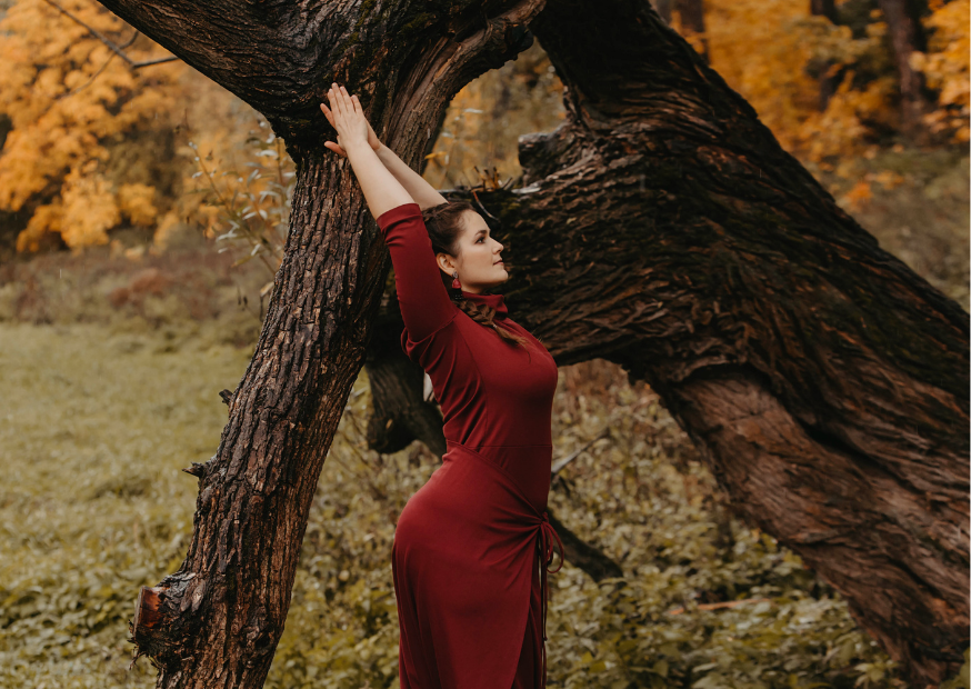 Women practising yoga outdoors