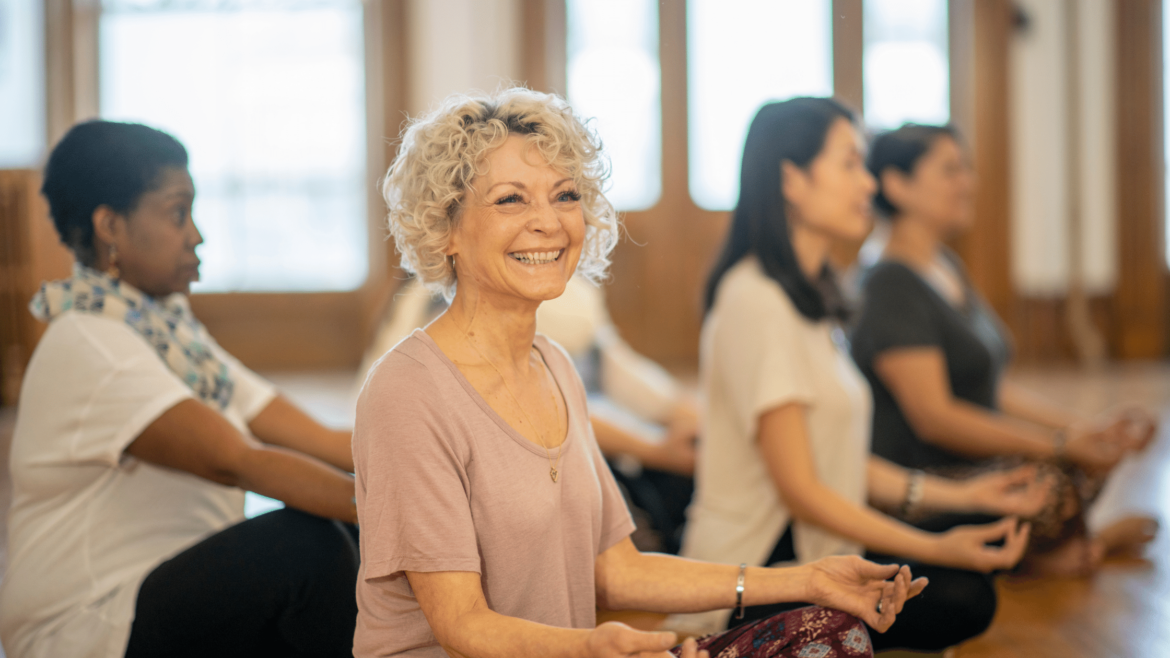 woman smiling in yoga class